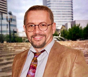 Jim Maxey wearing suite at Pioneer Square in Portland, Oregon